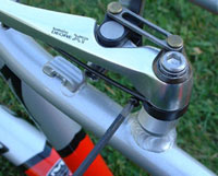 Turn the screw to center the brake