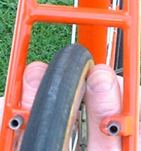 Use your fingers/thumbs to judge centering (brake removed for clarity)